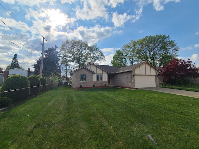3393 Kevin Cir, Warren, MI 48092 - view of front of property featuring a garage, concrete driveway, and brick siding