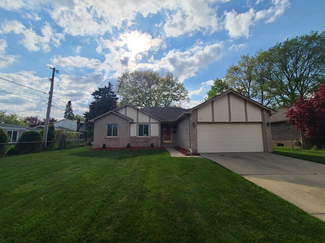 3393 Kevin Cir, Warren, MI 48092 - ranch-style house with brick siding, a garage, and concrete driveway