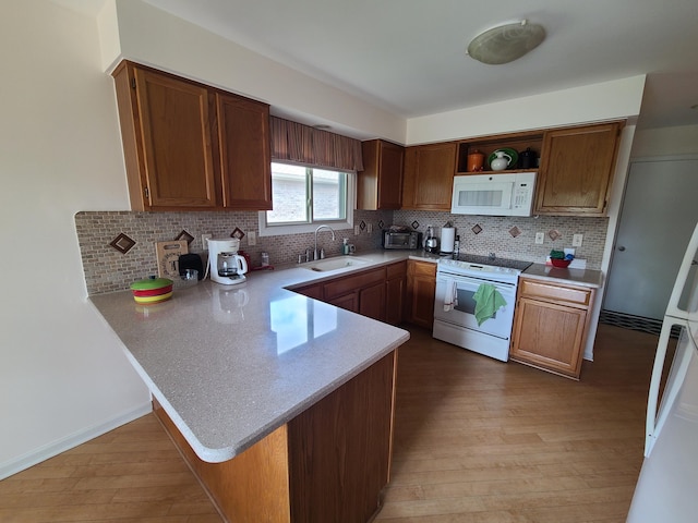 3393 Kevin Cir, Warren, MI 48092 - kitchen featuring white appliances, open shelves, a peninsula, light countertops, and light wood finished floors