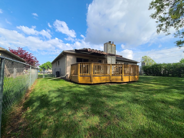 3393 Kevin Cir, Warren, MI 48092 - back of property with a wooden deck and a chimney