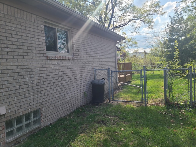 3393 Kevin Cir, Warren, MI 48092 - view of side of property with a gate and brick siding