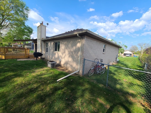 3393 Kevin Cir, Warren, MI 48092 - back of property with a chimney, a wooden deck, and brick siding
