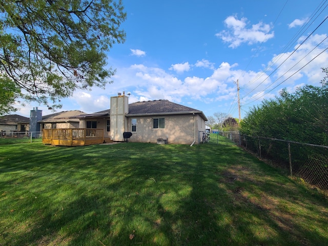 3393 Kevin Cir, Warren, MI 48092 - back of house featuring a fenced backyard, a deck, a chimney, and brick siding