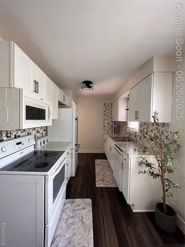 1918 Cherrylawn Dr, Flint, MI 48504 - kitchen featuring white appliances, dark wood-style floors, decorative backsplash, and light countertops