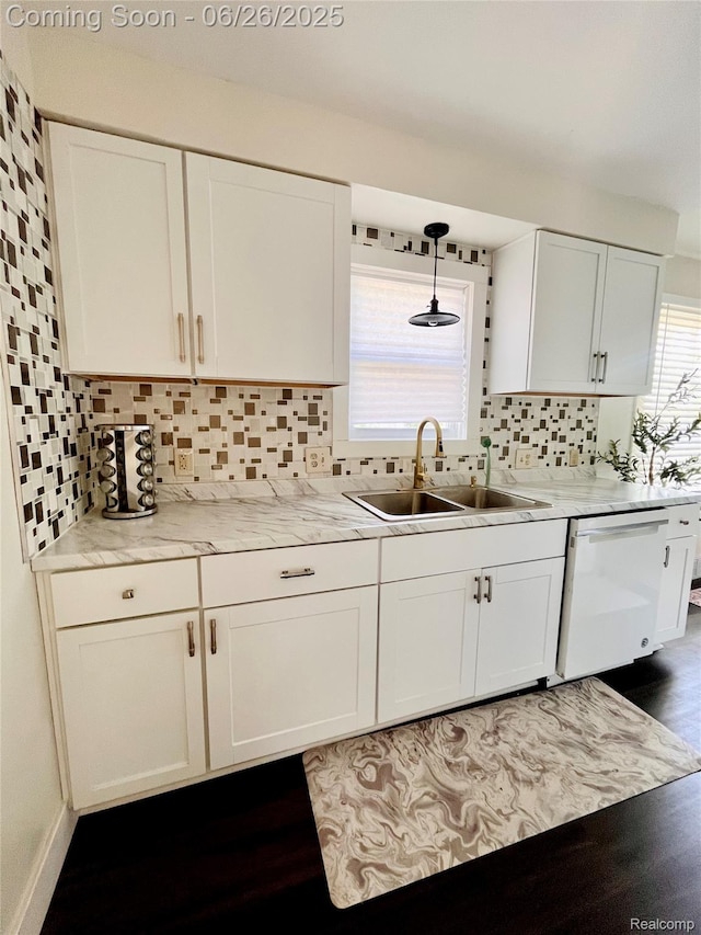 1918 Cherrylawn Dr, Flint, MI 48504 - kitchen featuring dishwasher, white cabinets, light countertops, tasteful backsplash, and hanging light fixtures