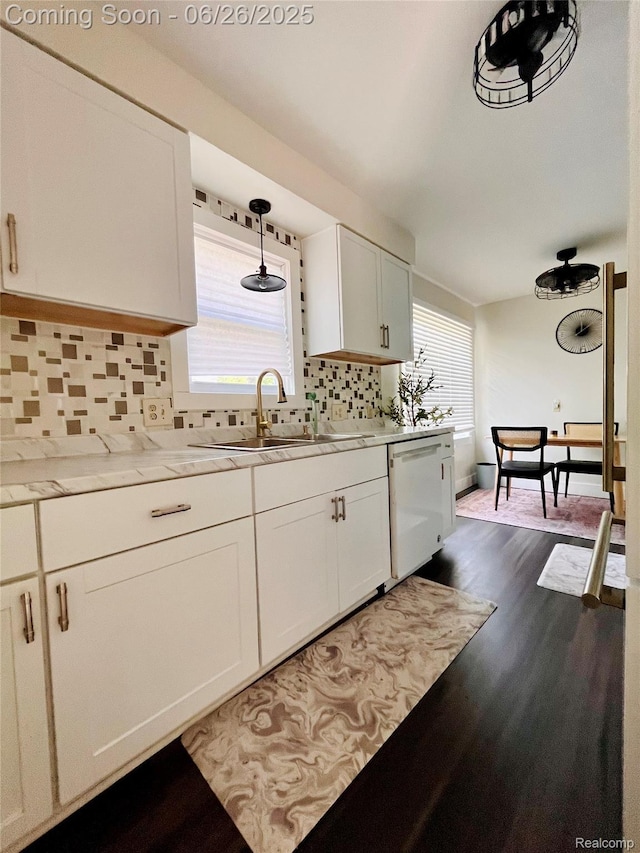 1918 Cherrylawn Dr, Flint, MI 48504 - kitchen with dishwasher, decorative backsplash, white cabinets, and dark wood-style flooring