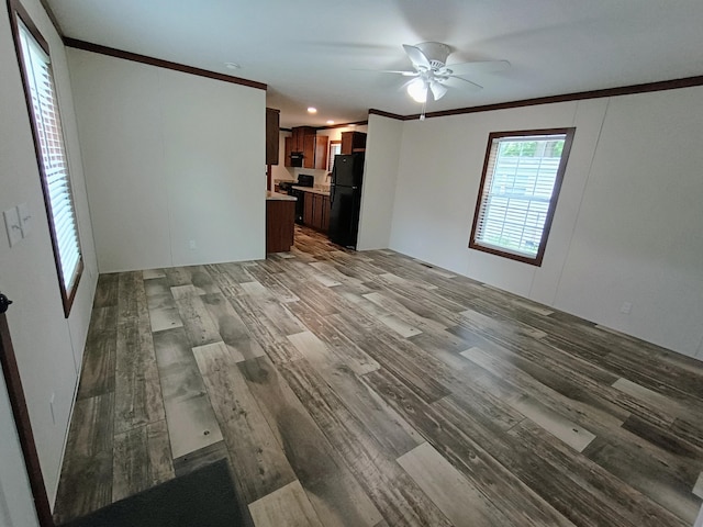 770 129th Ave Unit 4, Shelbyville, MI 49344 - unfurnished living room with crown molding, wood finished floors, and a ceiling fan