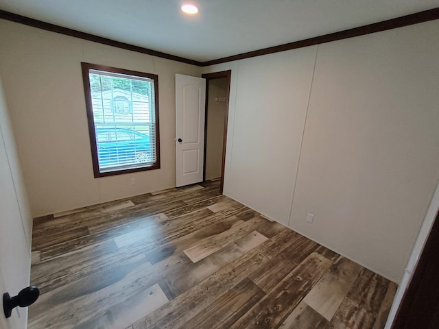 770 129th Ave Unit 4, Shelbyville, MI 49344 - unfurnished room featuring wood finished floors and ornamental molding