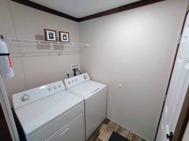 770 129th Ave Unit 4, Shelbyville, MI 49344 - washroom featuring independent washer and dryer and light wood-style floors