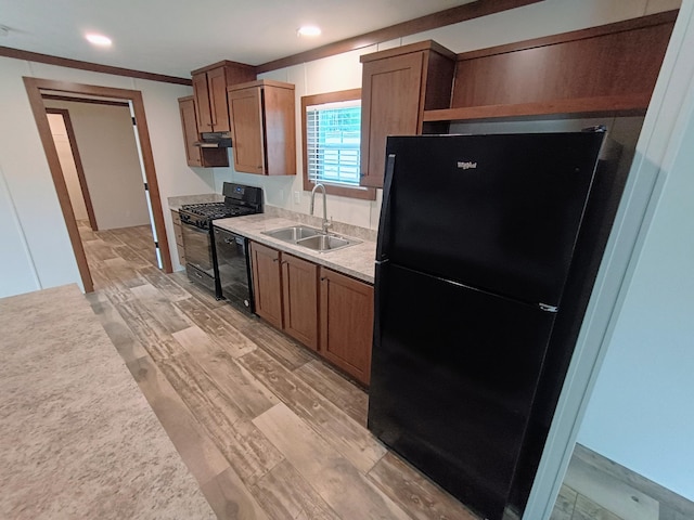 770 129th Ave Unit 4, Shelbyville, MI 49344 - kitchen featuring black appliances, under cabinet range hood, recessed lighting, light wood-style flooring, and light countertops