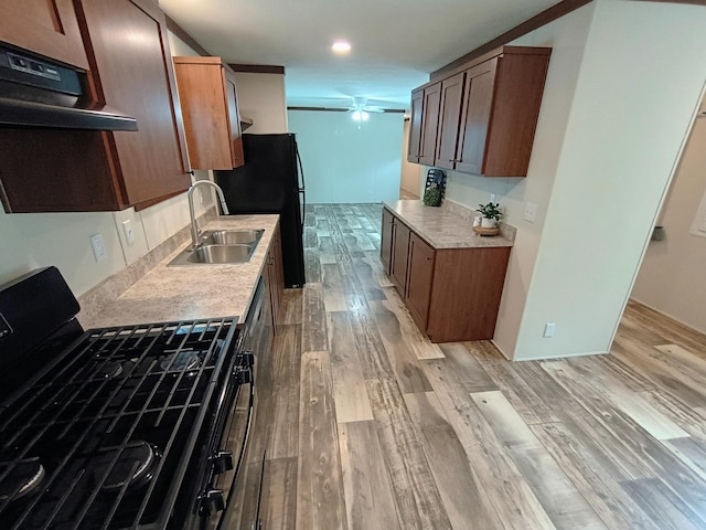 770 129th Ave Unit 4, Shelbyville, MI 49344 - kitchen with black appliances, exhaust hood, light wood finished floors, ceiling fan, and light countertops