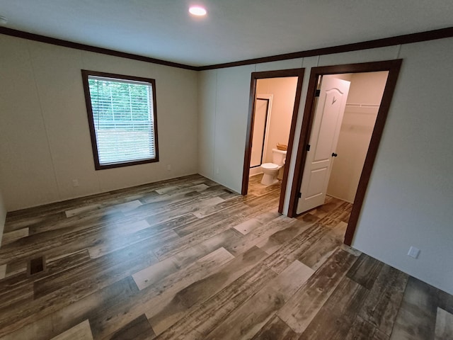 770 129th Ave Unit 4, Shelbyville, MI 49344 - spare room with ornamental molding and wood finished floors
