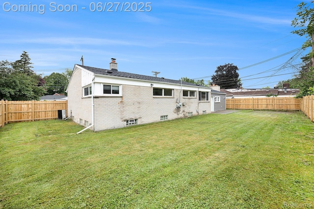 22252 Dale Allen St, Mount Clemens, MI 48035 - back of property featuring a chimney, a fenced backyard, and brick siding