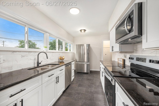 22252 Dale Allen St, Mount Clemens, MI 48035 - kitchen featuring stainless steel appliances, tasteful backsplash, dark stone countertops, white cabinets, and stone finish floors