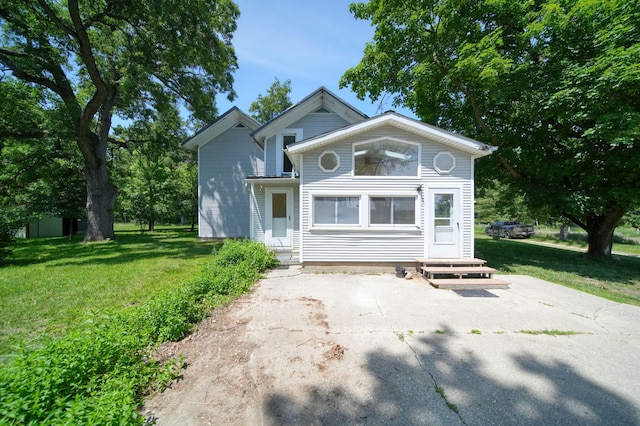 15379 Howard Rd, Hanover, MI 49241 - view of front of property featuring entry steps, a front lawn, and driveway