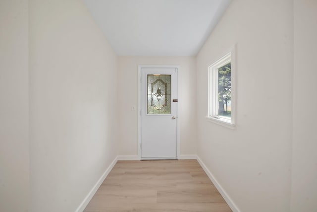 15379 Howard Rd, Hanover, MI 49241 - doorway with light wood finished floors and baseboards