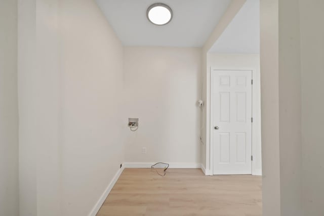 15379 Howard Rd, Hanover, MI 49241 - laundry area with light wood-style floors and hookup for a washing machine