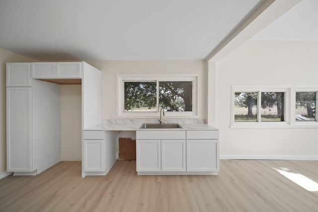 15379 Howard Rd, Hanover, MI 49241 - kitchen featuring light wood finished floors, light countertops, and white cabinetry