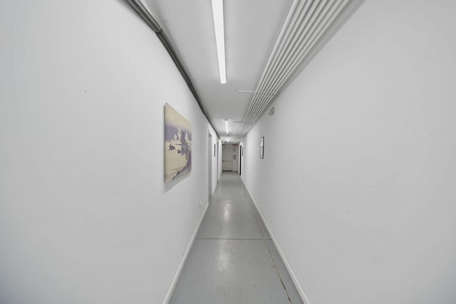 15379 Howard Rd, Hanover, MI 49241 - corridor featuring finished concrete flooring and baseboards