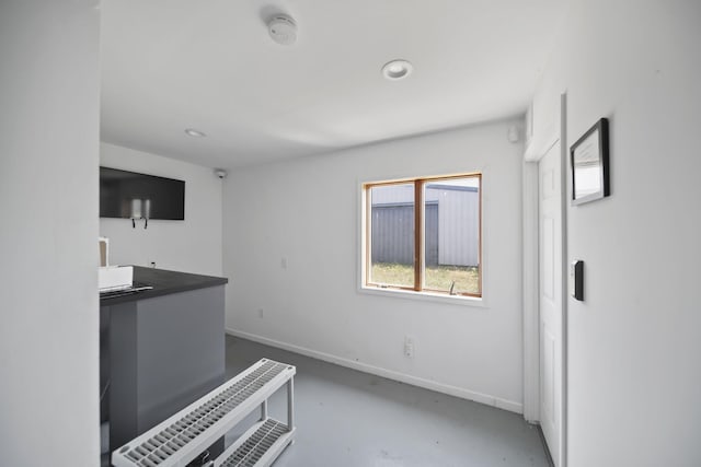 15379 Howard Rd, Hanover, MI 49241 - unfurnished living room featuring finished concrete floors and recessed lighting