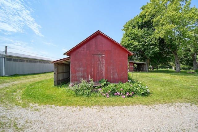 15379 Howard Rd, Hanover, MI 49241 - view of pole building with a yard