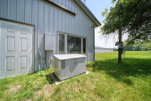 15379 Howard Rd, Hanover, MI 49241 - exterior view of a power unit and board and batten siding