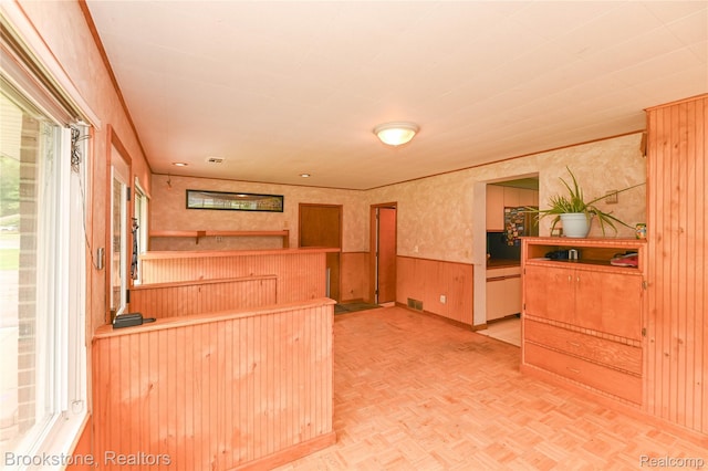 37411 Edgewood St, Clinton Township, MI 48036 - kitchen featuring wainscoting, healthy amount of natural light, wallpapered walls, and wood walls