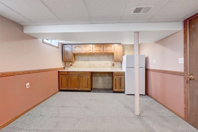 33911 Pawnee St, Westland, MI 48185 - finished below grade area with freestanding refrigerator, light carpet, and a drop ceiling