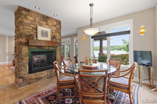 14967 S Shore Dr, Addison, MI 49220 - dining area with a stone fireplace and recessed lighting