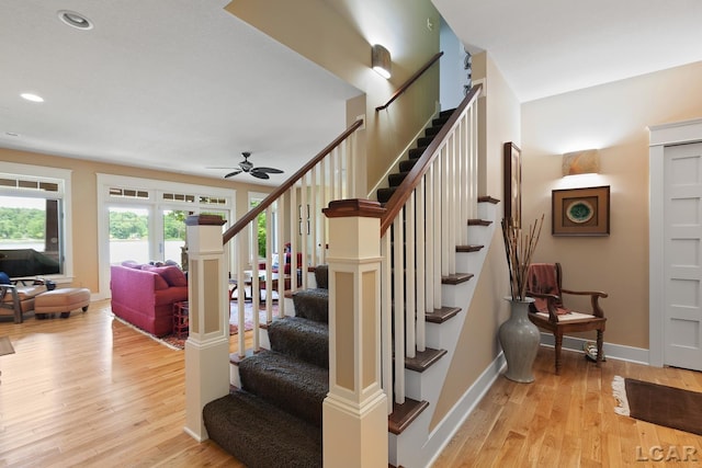 14967 S Shore Dr, Addison, MI 49220 - stairs featuring a ceiling fan, wood finished floors, and recessed lighting