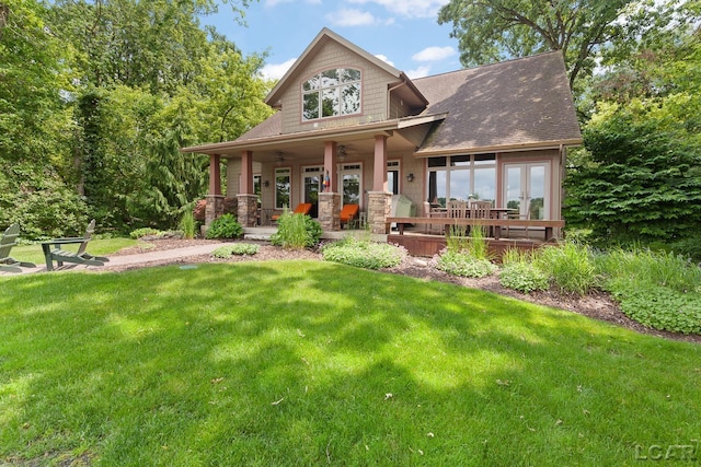 14967 S Shore Dr, Addison, MI 49220 - back of property featuring a yard, roof with shingles, and french doors