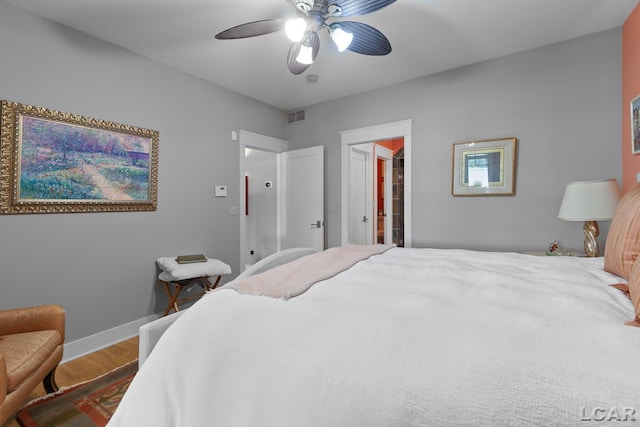 14967 S Shore Dr, Addison, MI 49220 - bedroom with wood finished floors and ceiling fan