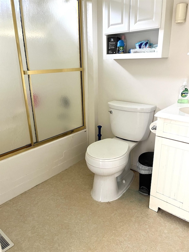 5425 Westchester Dr, Flint, MI 48532 - bathroom featuring vanity and bath / shower combo with glass door