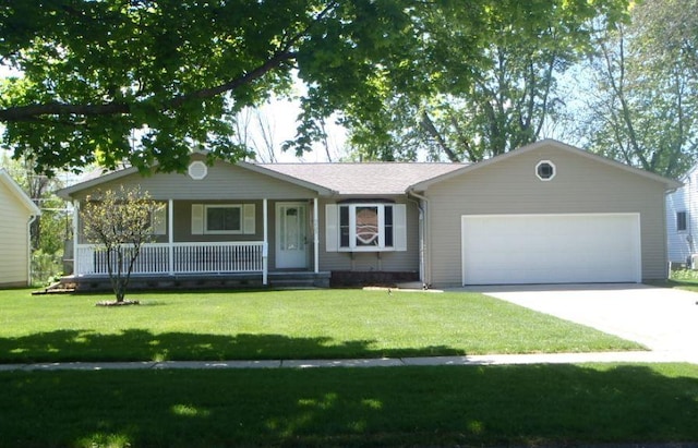 5425 Westchester Dr, Flint, MI 48532 - single story home featuring a porch, a garage, driveway, and a front lawn