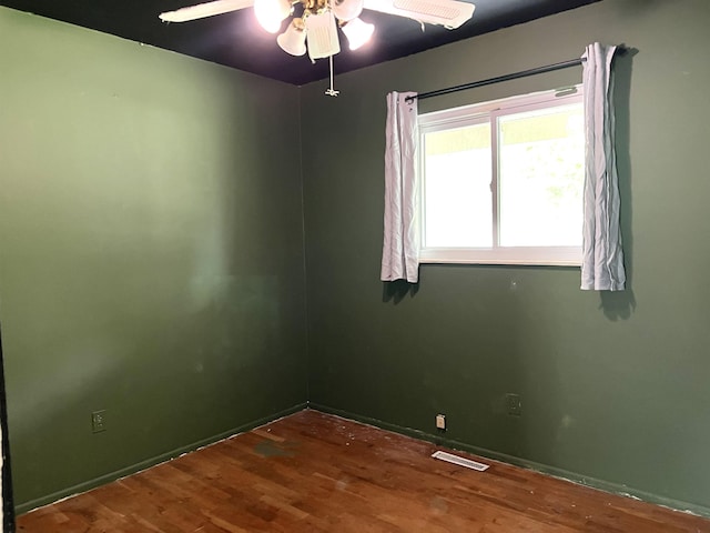 5425 Westchester Dr, Flint, MI 48532 - spare room featuring wood finished floors and a ceiling fan