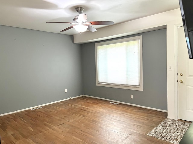 5425 Westchester Dr, Flint, MI 48532 - spare room with ceiling fan and wood finished floors