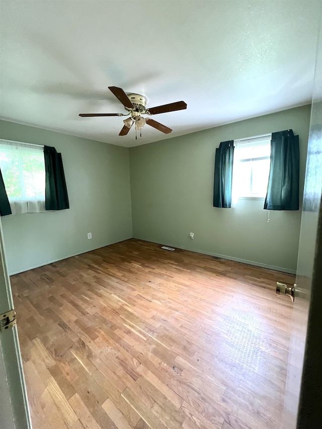 5425 Westchester Dr, Flint, MI 48532 - spare room featuring wood finished floors and a ceiling fan