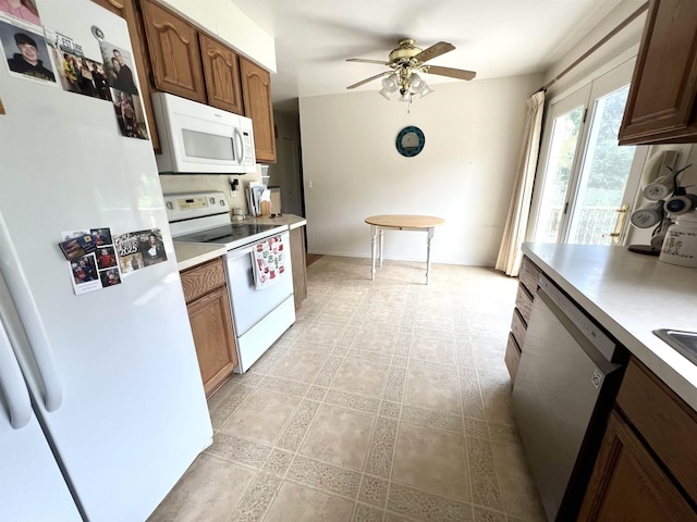 5425 Westchester Dr, Flint, MI 48532 - kitchen featuring white appliances, ceiling fan, light countertops, and light tile patterned flooring