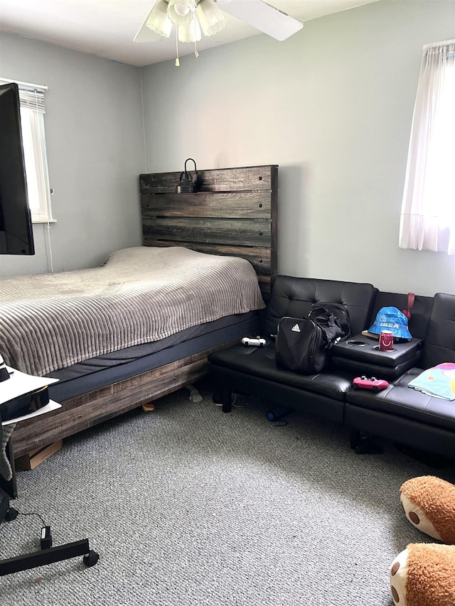 5425 Westchester Dr, Flint, MI 48532 - carpeted bedroom featuring multiple windows and a ceiling fan