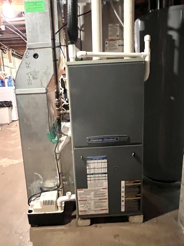 5425 Westchester Dr, Flint, MI 48532 - utilities featuring water heater and washer / clothes dryer