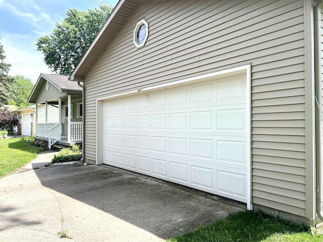 5425 Westchester Dr, Flint, MI 48532 - garage featuring driveway and a porch