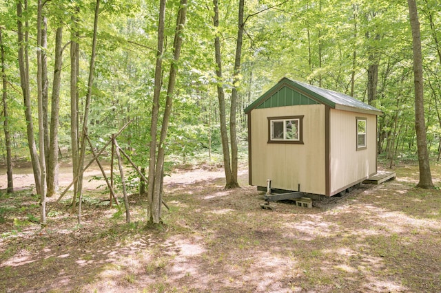 122 Canyon Rd, Leroy, MI 49655 - view of shed with a wooded view