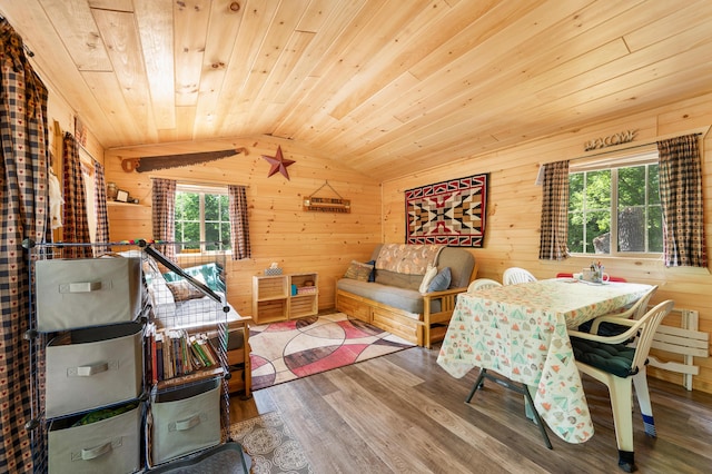 122 Canyon Rd, Leroy, MI 49655 - dining space featuring wooden ceiling, wood walls, wood finished floors, and vaulted ceiling