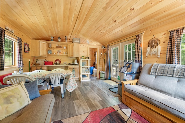 122 Canyon Rd, Leroy, MI 49655 - living area featuring wood walls, healthy amount of natural light, dark wood finished floors, vaulted ceiling, and wood ceiling
