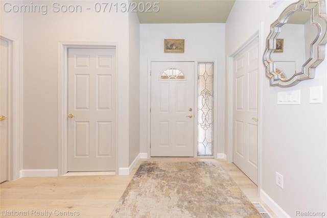 285 Ash Ct, South Lyon, MI 48178 - entryway with light wood-type flooring and baseboards