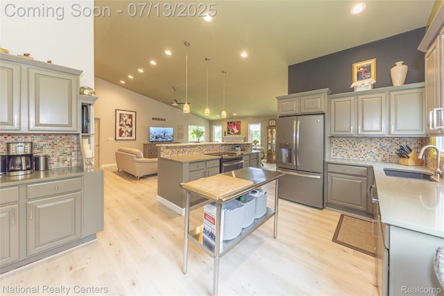 285 Ash Ct, South Lyon, MI 48178 - kitchen featuring stainless steel fridge with ice dispenser, light wood-style floors, backsplash, gray cabinets, and recessed lighting