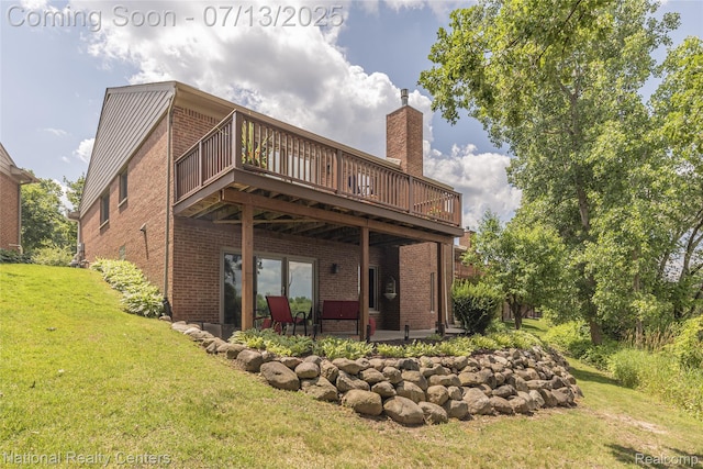 285 Ash Ct, South Lyon, MI 48178 - rear view of house featuring brick siding, a lawn, a patio, a deck, and a chimney