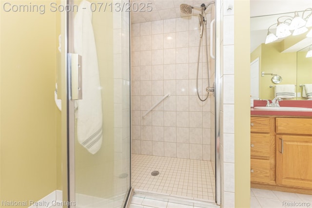 285 Ash Ct, South Lyon, MI 48178 - bathroom featuring a stall shower, vanity, and tile patterned floors