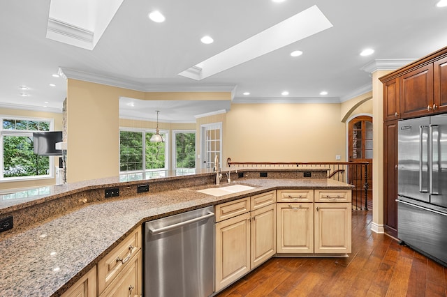 1431 Edgemoor Ave, Kalamazoo, MI 49008 - kitchen featuring appliances with stainless steel finishes, a skylight, light stone counters, recessed lighting, and dark wood-type flooring