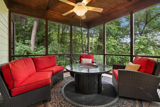 1431 Edgemoor Ave, Kalamazoo, MI 49008 - sunroom / solarium featuring an outdoor living space with a fire pit, a ceiling fan, and healthy amount of natural light